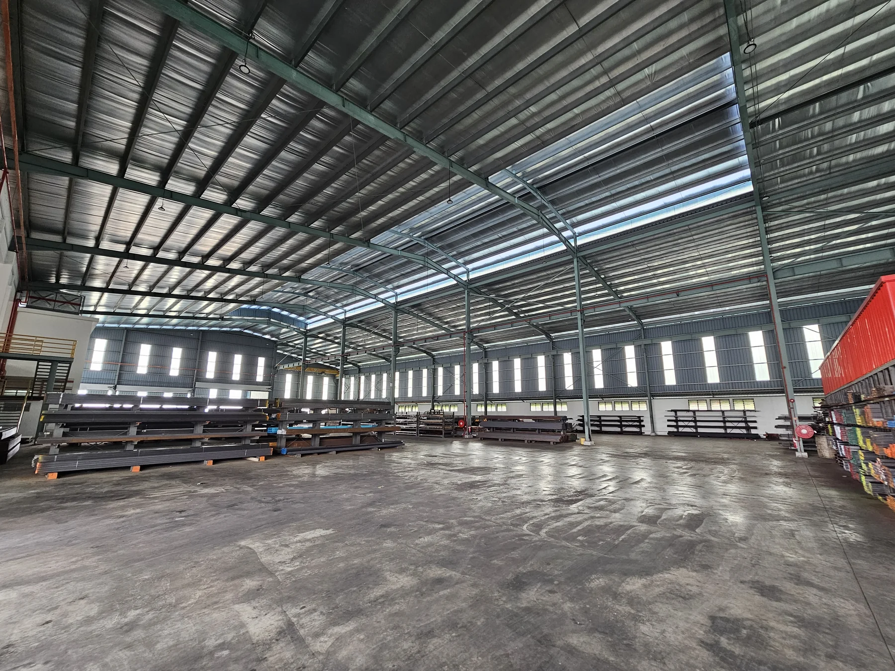 Wide interior view showing the scale of the KYS Steel warehouse in Nilai